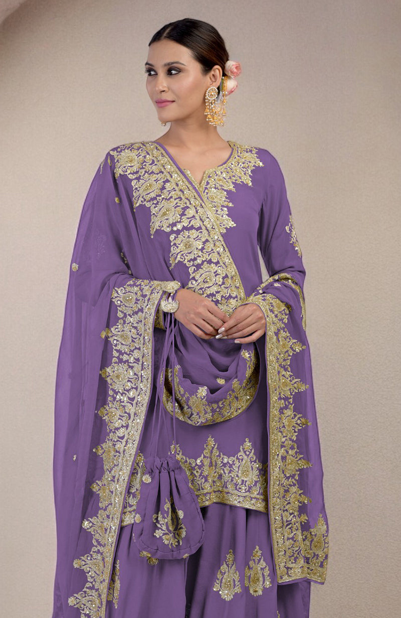 A woman models an amethyst orchid sharara set with gold embroidery and a matching potli bag.