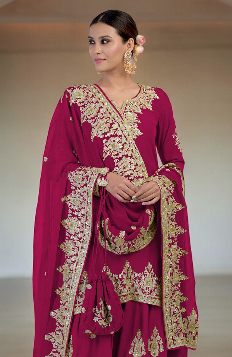 A woman models a bright rose sharara set with gold Kashmiri tilla and zardozi embroidery.