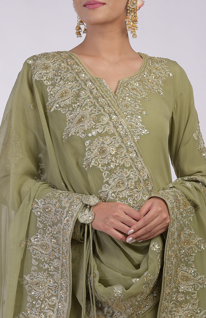 Bog green sharara set with gold Kashmiri tilla and zardozi hand embroidery.