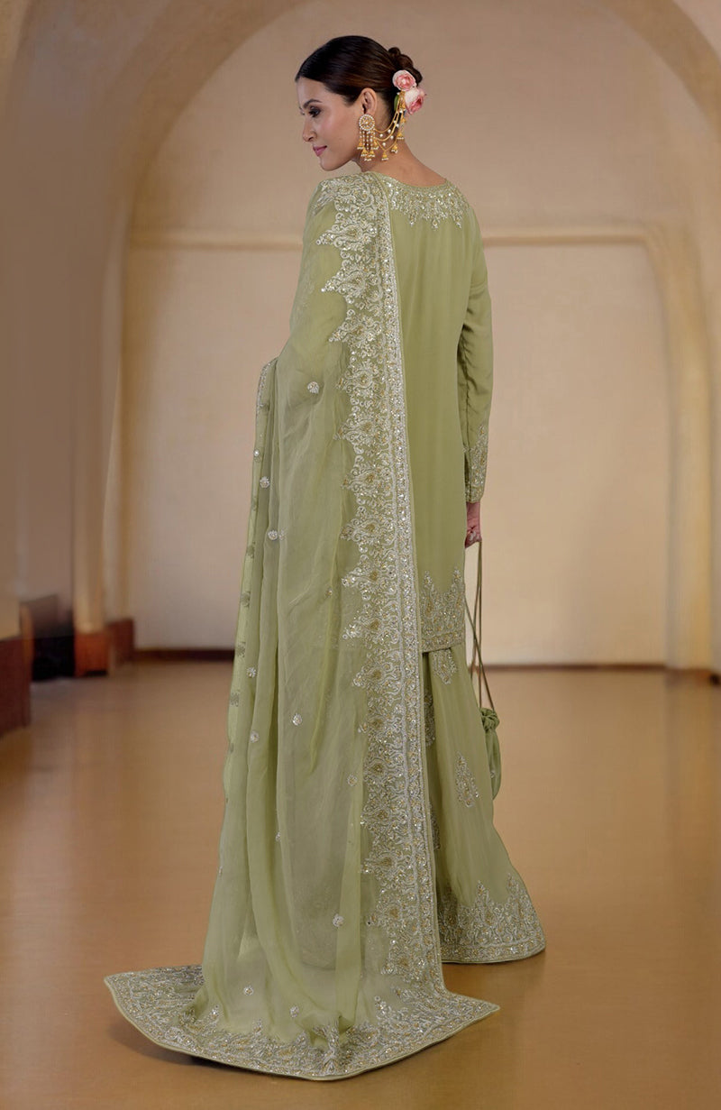 Bog green sharara set with gold Kashmiri tilla and zardozi hand embroidery.