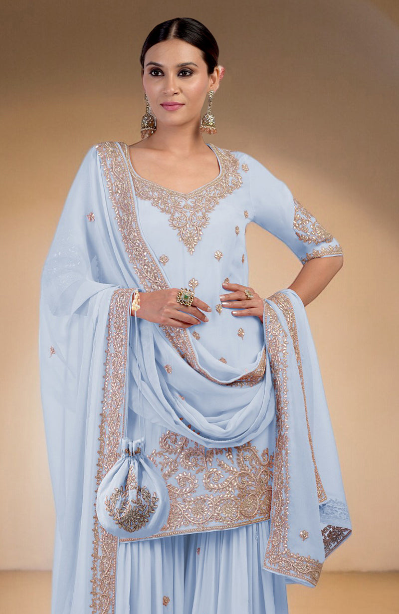 An Illusion Blue Sharara Set with intricate marori gota patti and zardozi hand embroidery.
