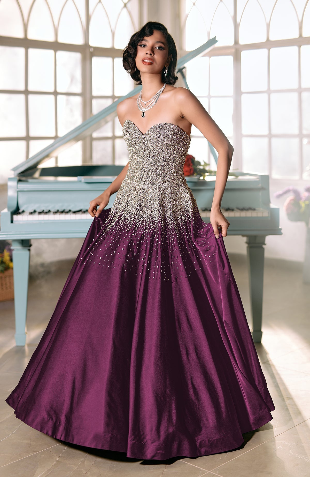 Plum satin princess gown with crystal and pearl bead embroidery on corset bodice and skirt