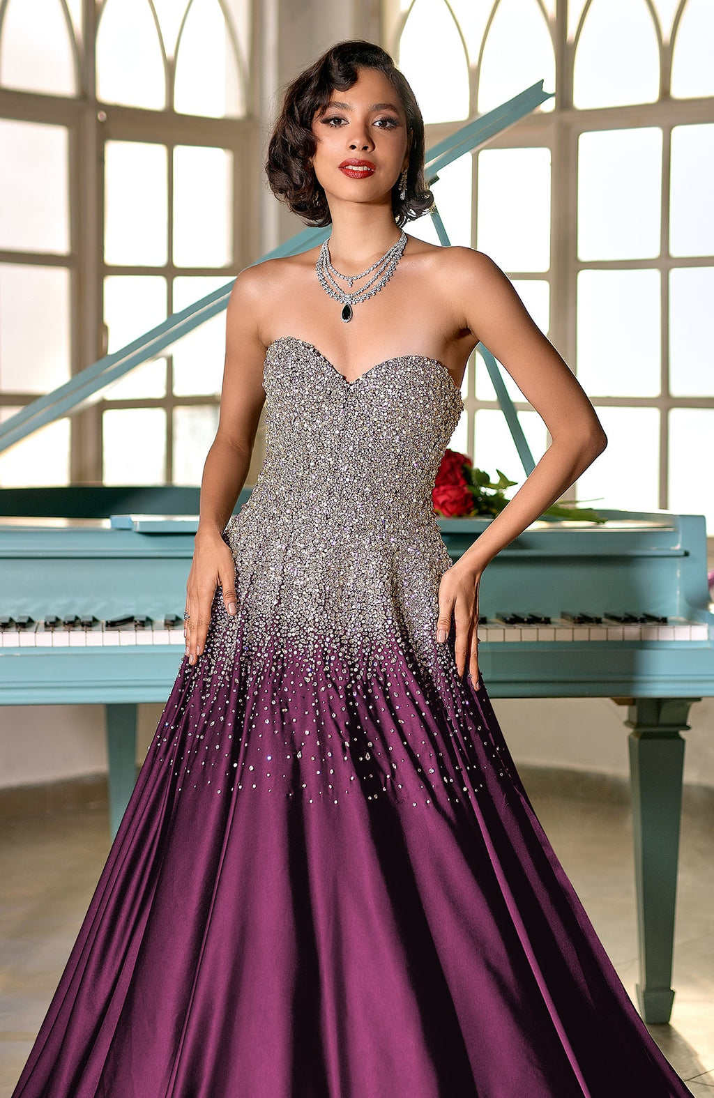 Plum satin princess gown with crystal and pearl bead embroidery on corset bodice and skirt