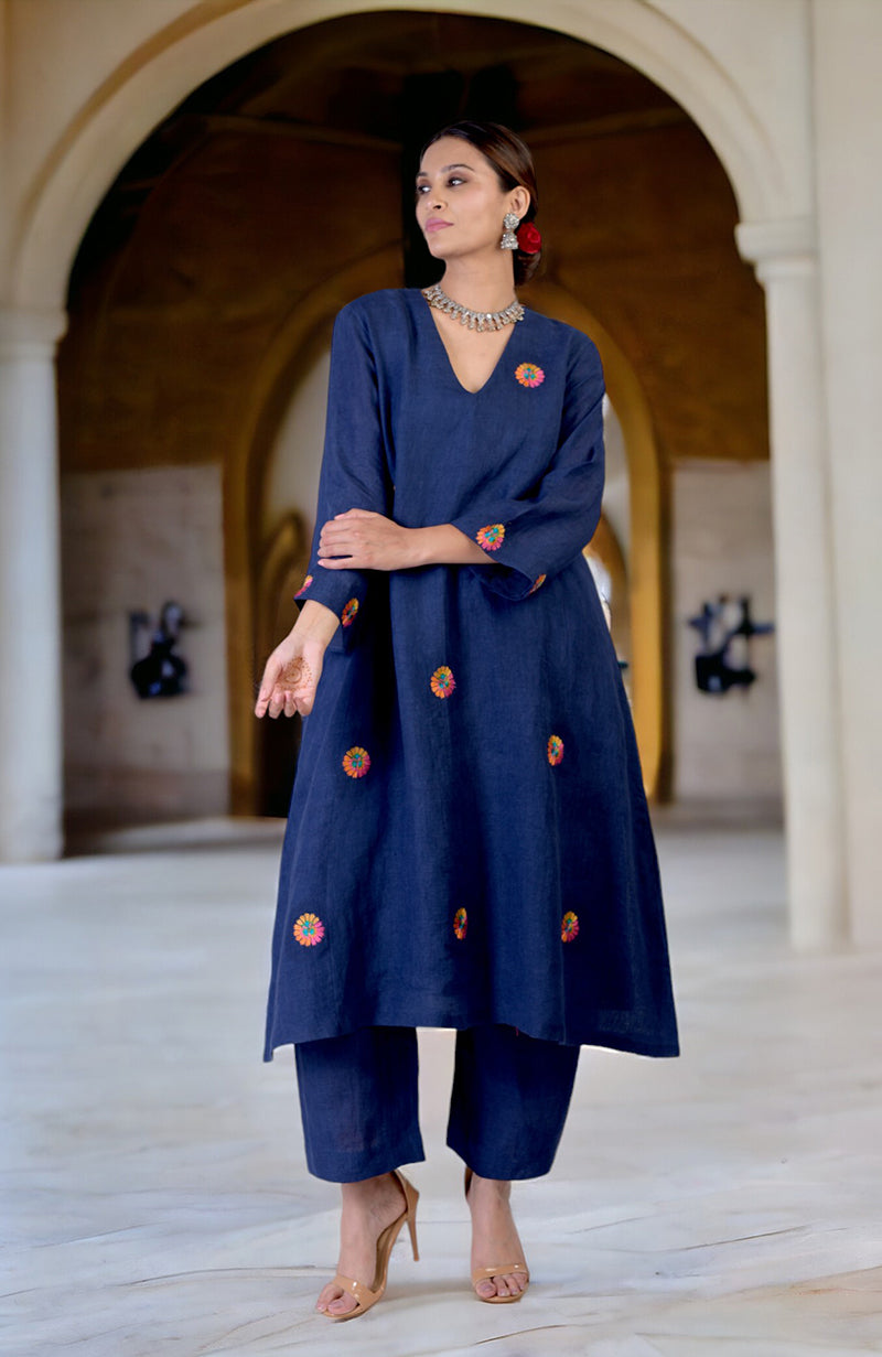Navy blue linen kurta set with multi-hued Kashida embroidery.