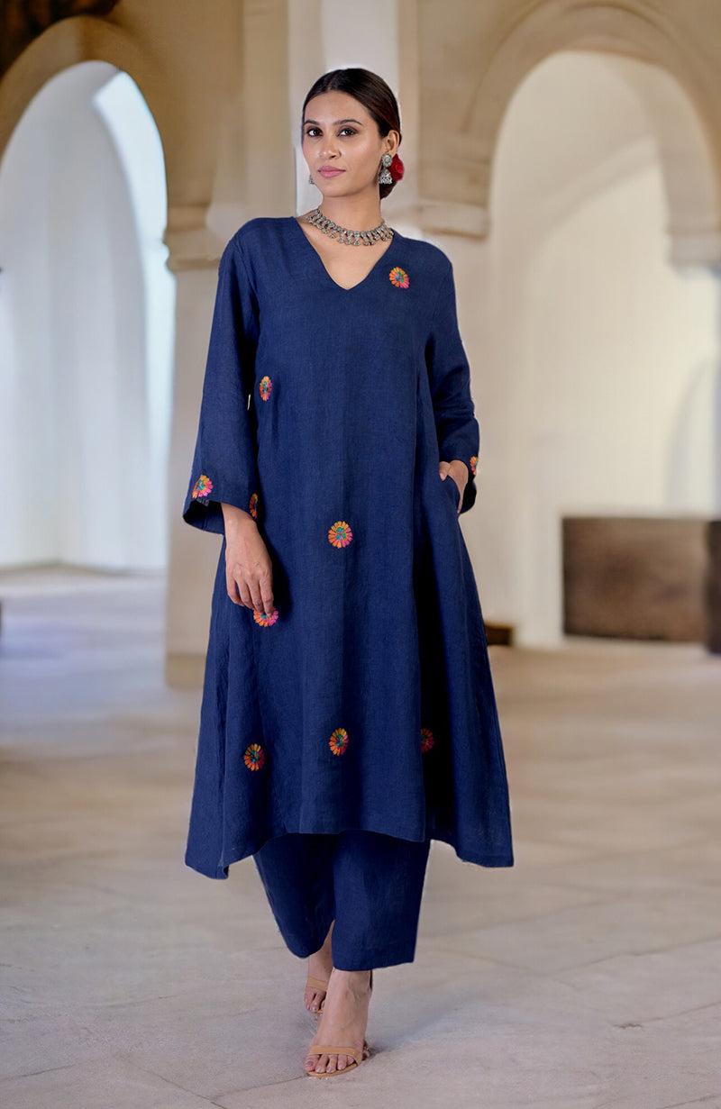 Navy blue linen kurta set with colorful Kashidakari embroidery and wide-leg pants.