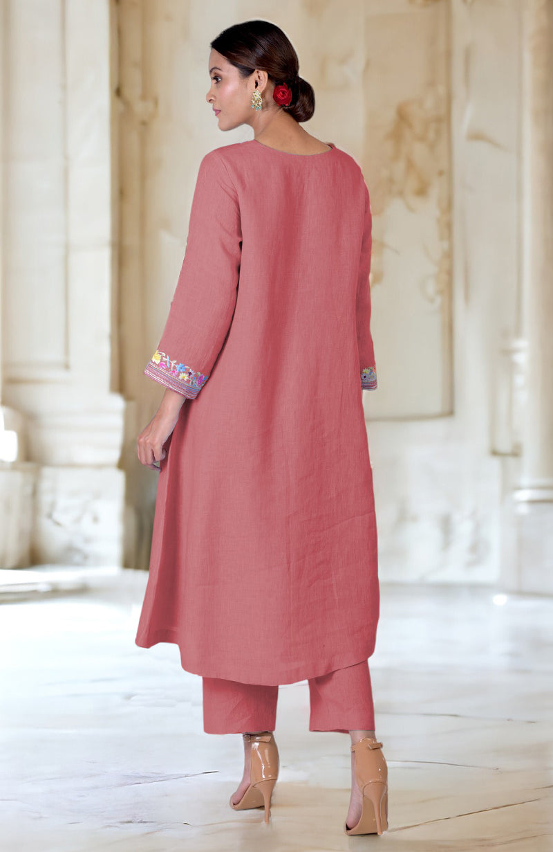 A woman models a desert rose Parsi Gara embroidered linen kurta set.