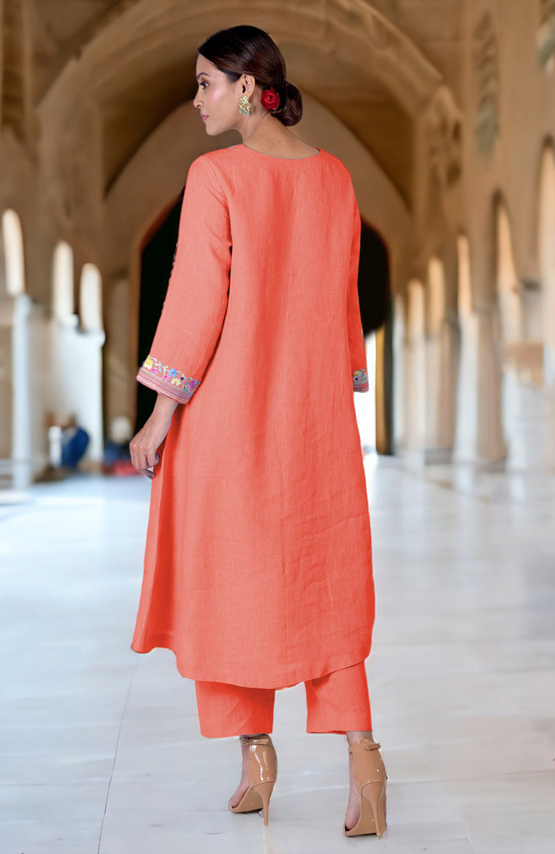 Living coral Parsi Gara embroidered linen kurta set with matching pants and heels.