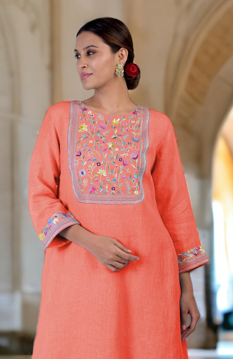 Living coral linen kurta with colorful Parsi Gara embroidery on the neckline and sleeves.
