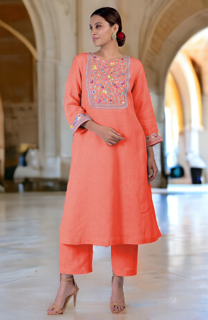 Living coral linen kurta set with Parsi Gara embroidery on the neckline and sleeves.