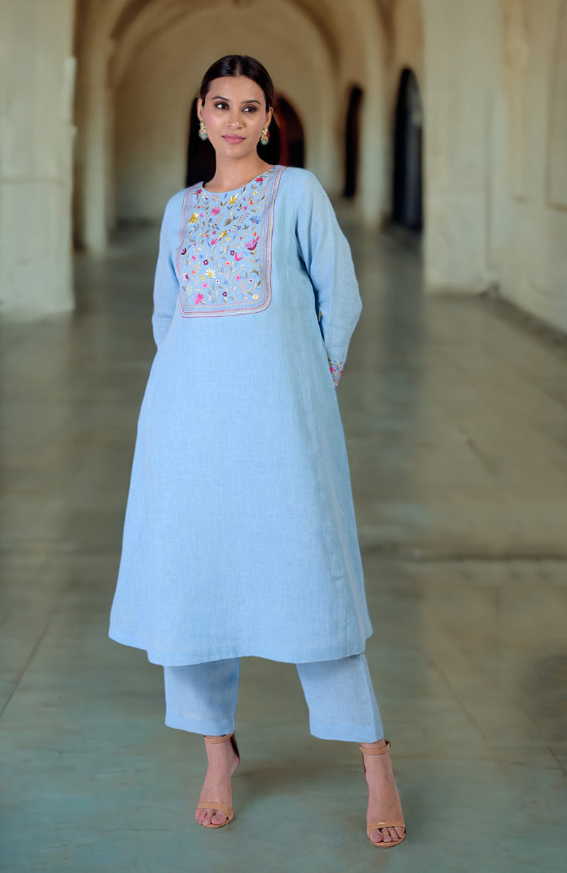 Cerulean blue linen kurta set with Parsi Gara embroidery on the neckline and sleeves.