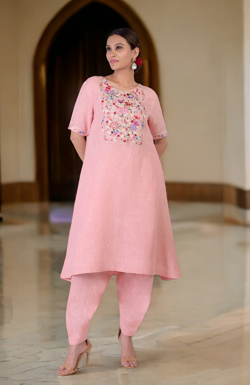 Pink linen kurta set with Parsi Gara embroidery on the neckline and sleeves.