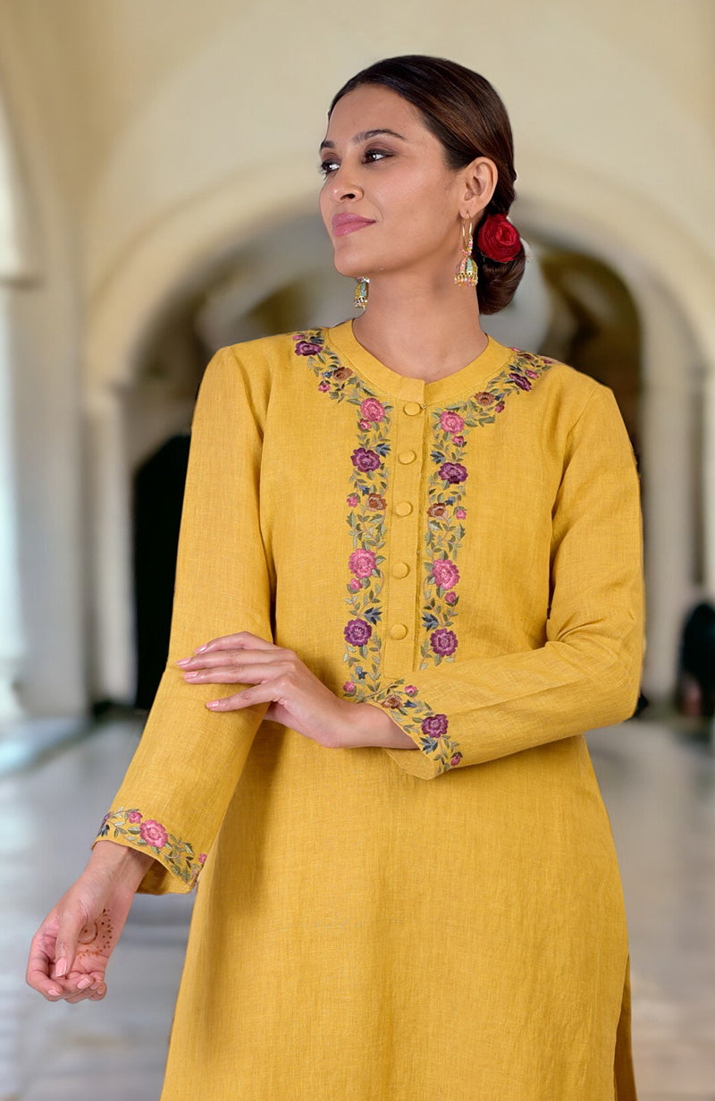Calendula yellow linen kurta set with Parsi Gara embroidery on the neckline and sleeves.