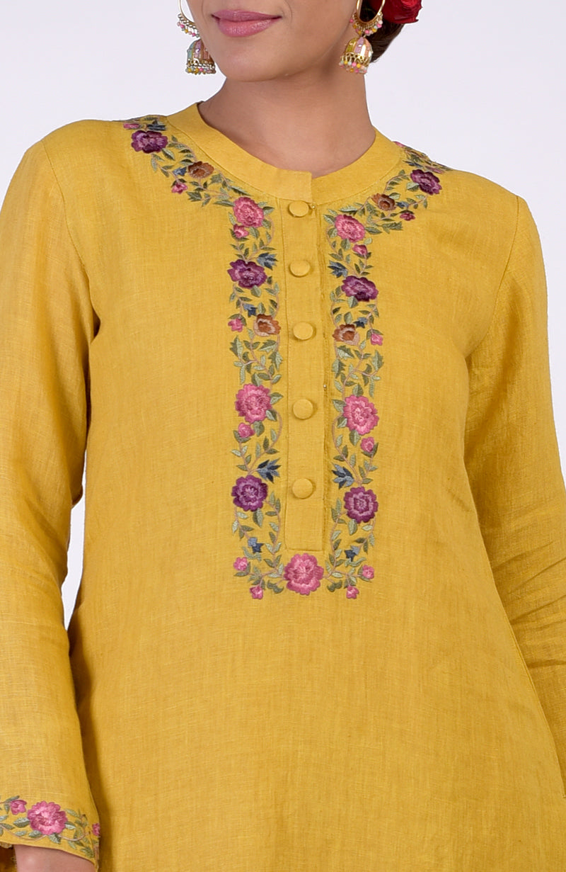 Calendula yellow linen kurta with colorful Parsi Gara embroidery on the neckline.