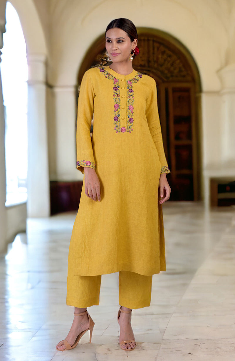 Calendula yellow linen kurta set with Parsi Gara embroidery on the neckline and sleeves.