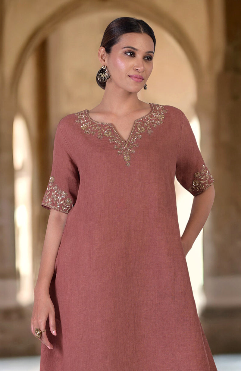 Chutney marori embroidered linen kurta with gold embroidery on the neckline and sleeves.