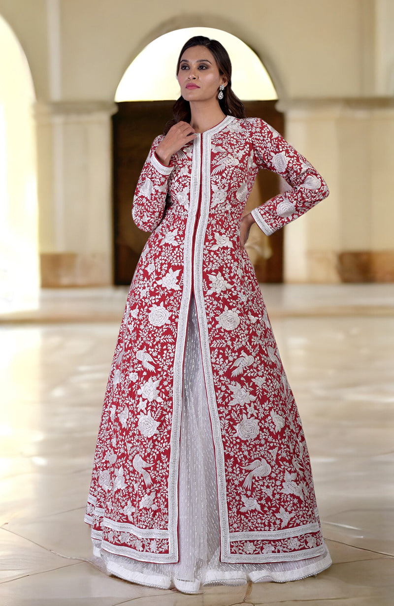 Red Parsi Gara and beads embroidered jacket set with an off-white skirt.