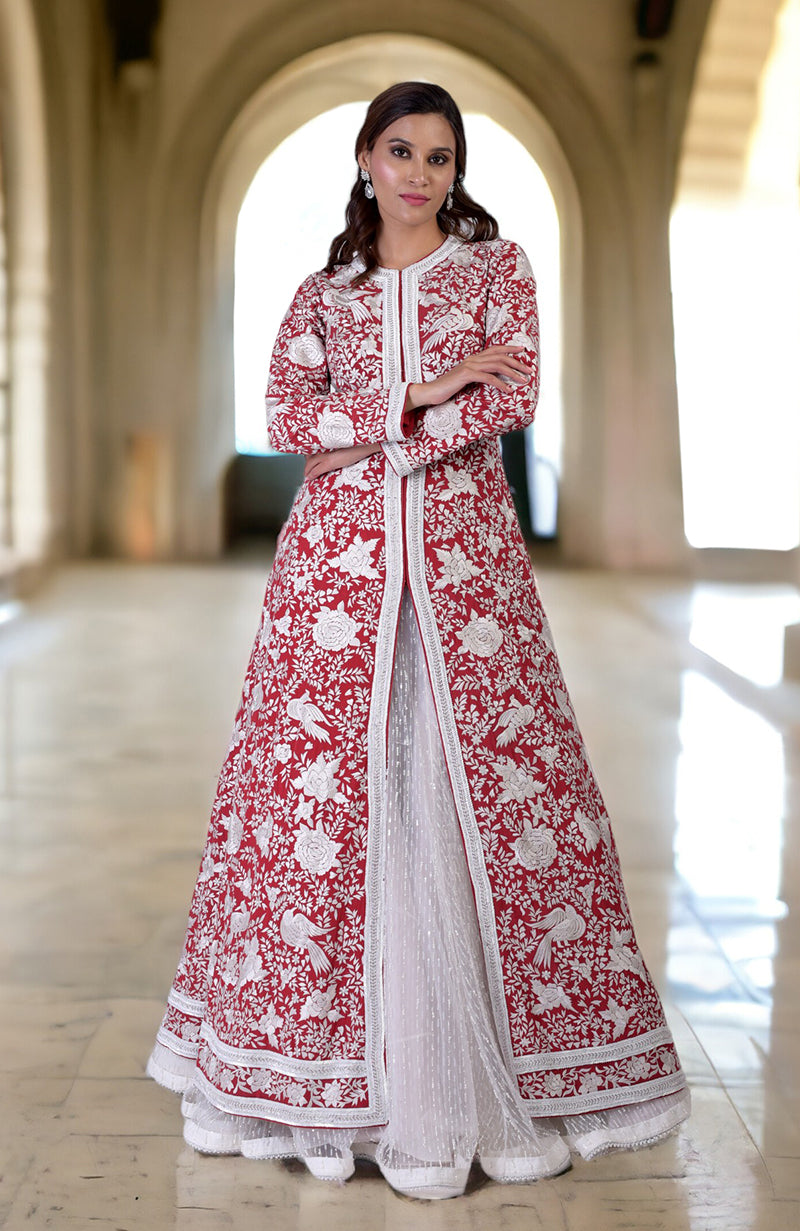 Red Parsi Gara jacket with ivory embroidery and beadwork, paired with an off-white skirt.