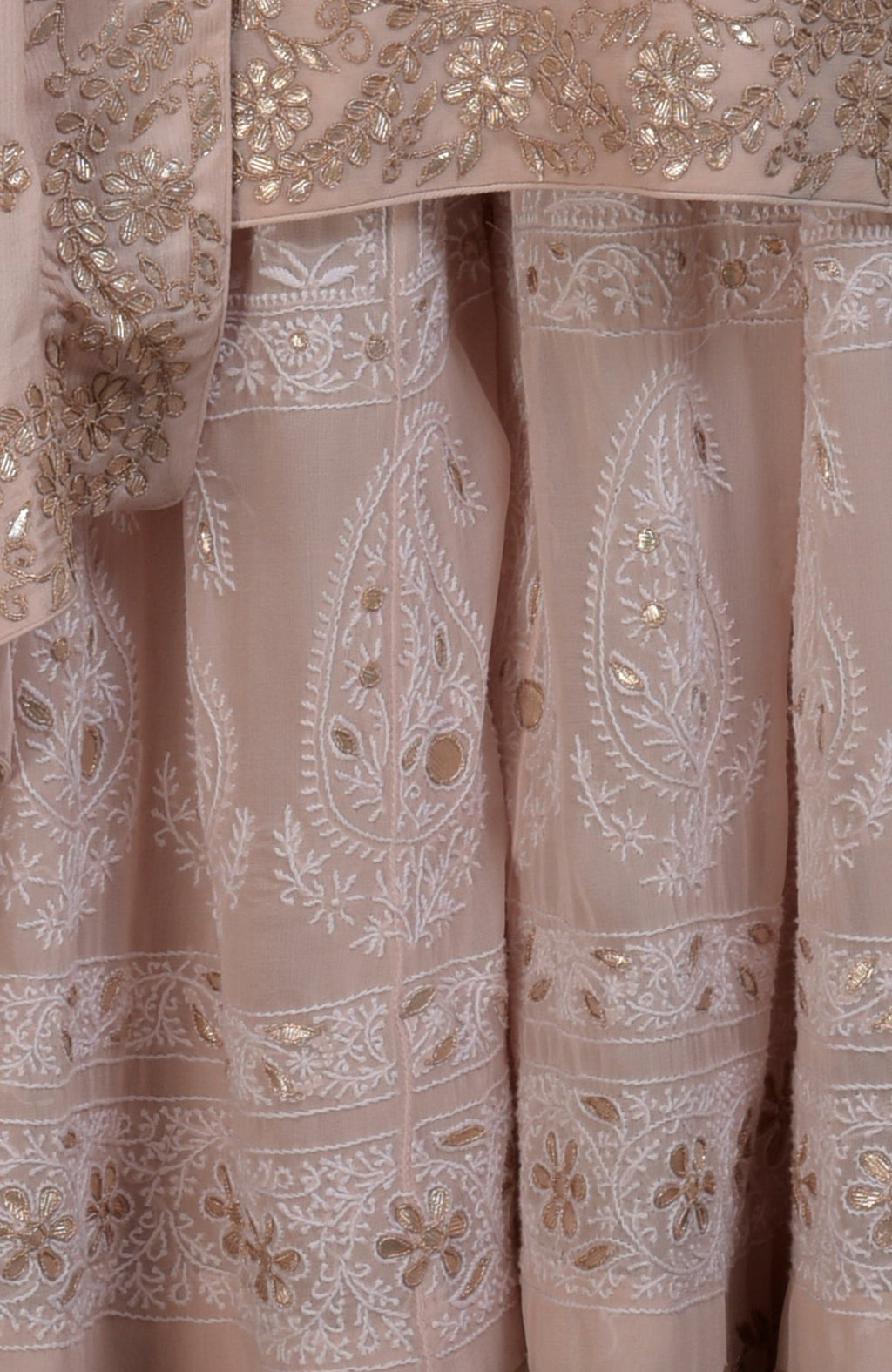 Oyster pink Chikankari and Gota Patti hand-embroidered sharara suit.