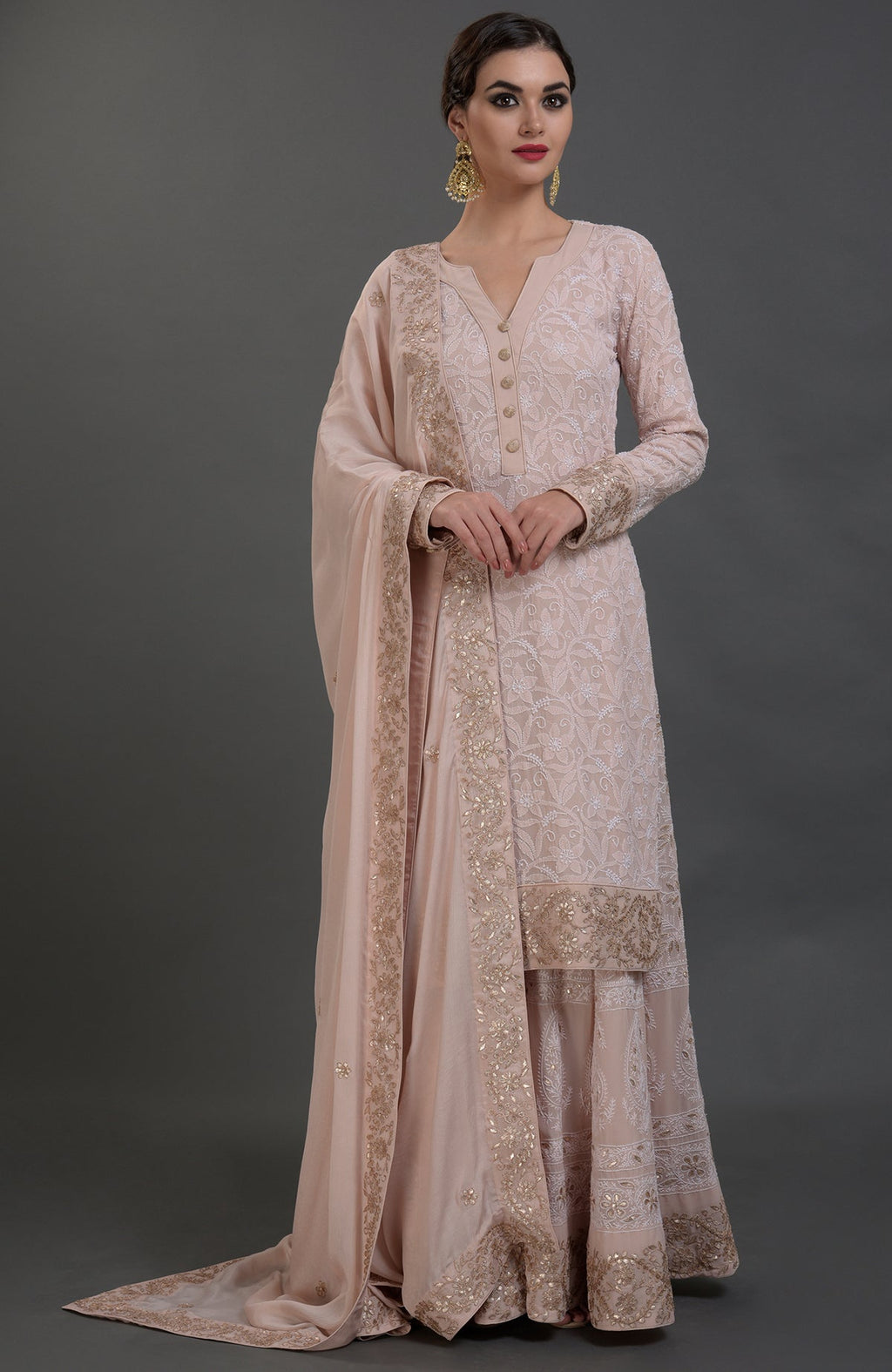 Chikankari and Gota Patti hand embroidered sharara suit in oyster pink.