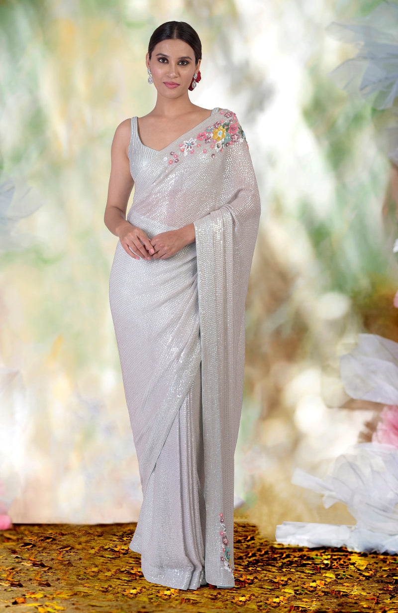 Whispering blue floral sequin hand embroidered saree with a matching blouse.