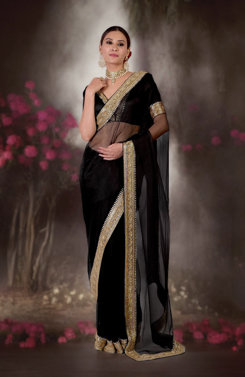 Black saree with gold beads and zardozi hand embroidery.
