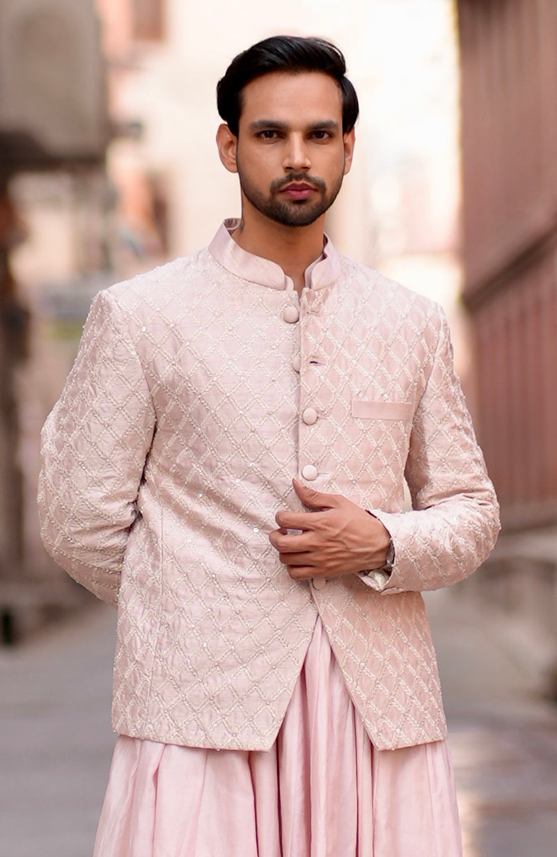 Barely pink chikankari embellished bandhgala and angarkha kurta set.