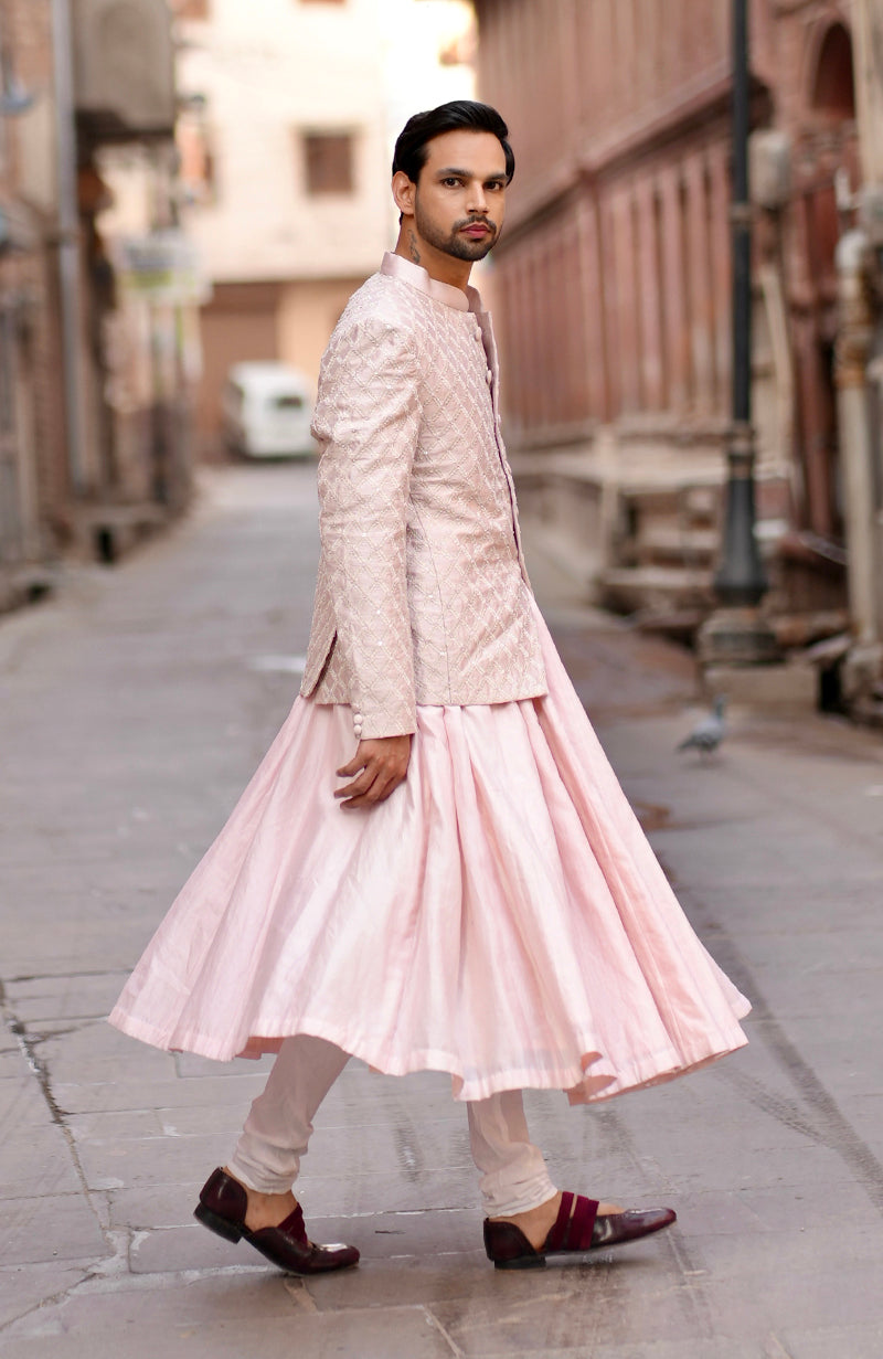 Barely pink chikankari embellished bandhgala and angarkha kurta set.