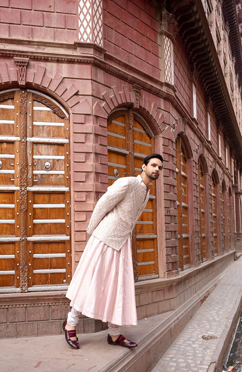 Barely pink chikankari embellished bandhgala and angarkha kurta set.