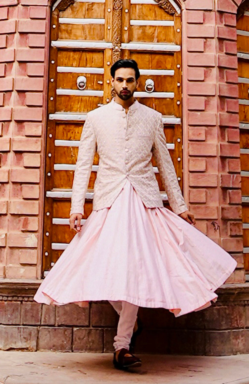 Barely pink chikankari embellished bandhgala and angarkha kurta set.