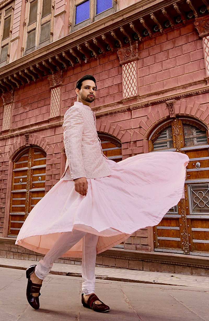 Barely pink chikankari embellished bandhgala and angarkha kurta set.