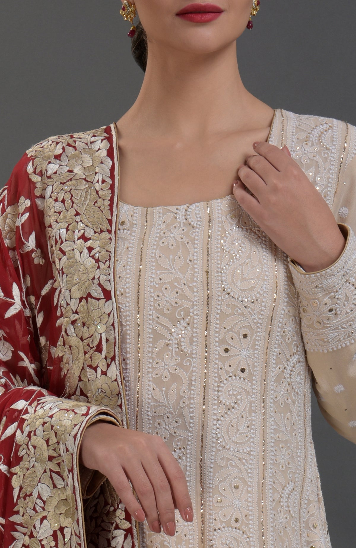 Champagne Chikankari Anarkali suit with gold kamdani work and red Parsi Gara embroidered dupatta.
