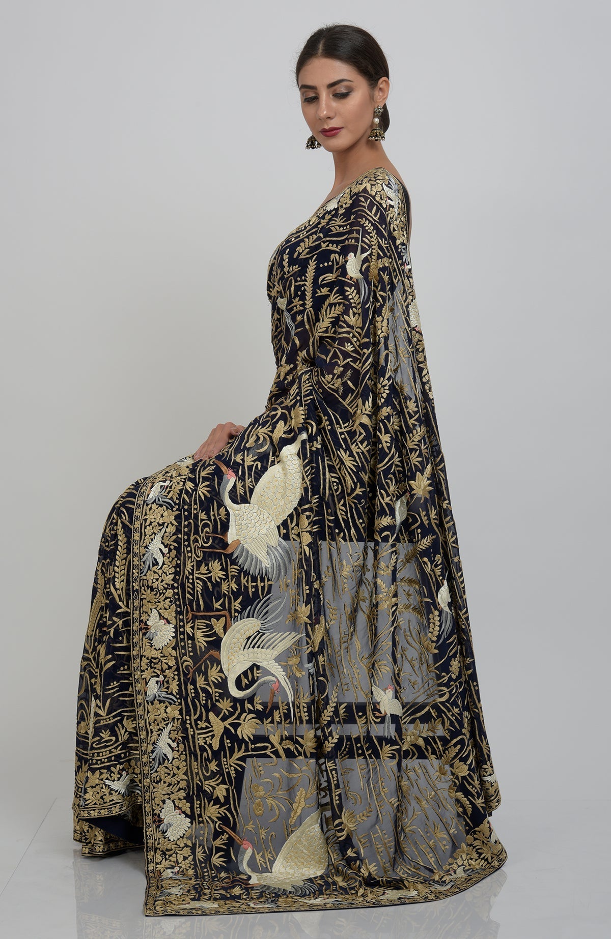 Midnight blue Parsi Gara hand-embroidered saree with crane and floral motifs.