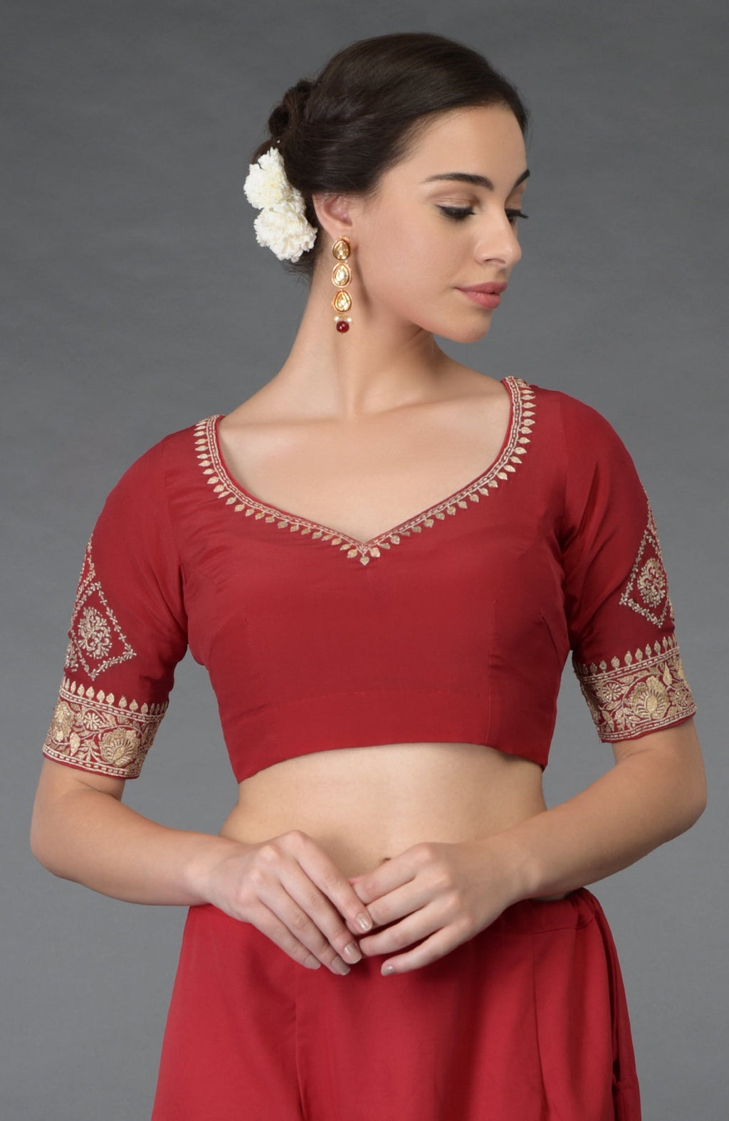 Red gold tilla embroidered blouse with a sweetheart neckline and elbow-length sleeves.