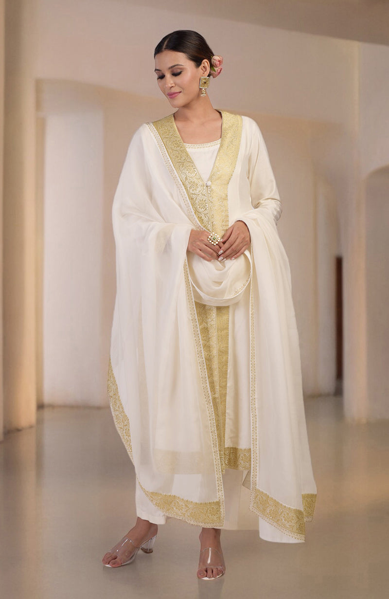 An ivory and gold Banarasi handwoven overlay set with a matching dupatta and pants.