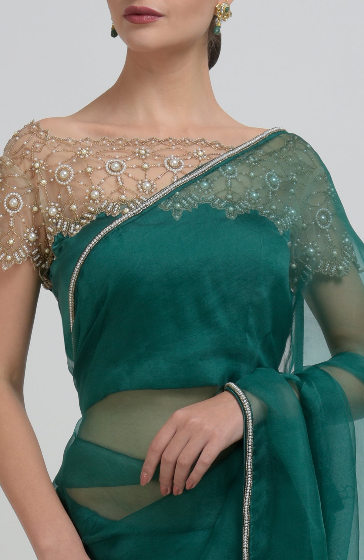 Emerald green pearl beads hand embroidered saree and blouse.