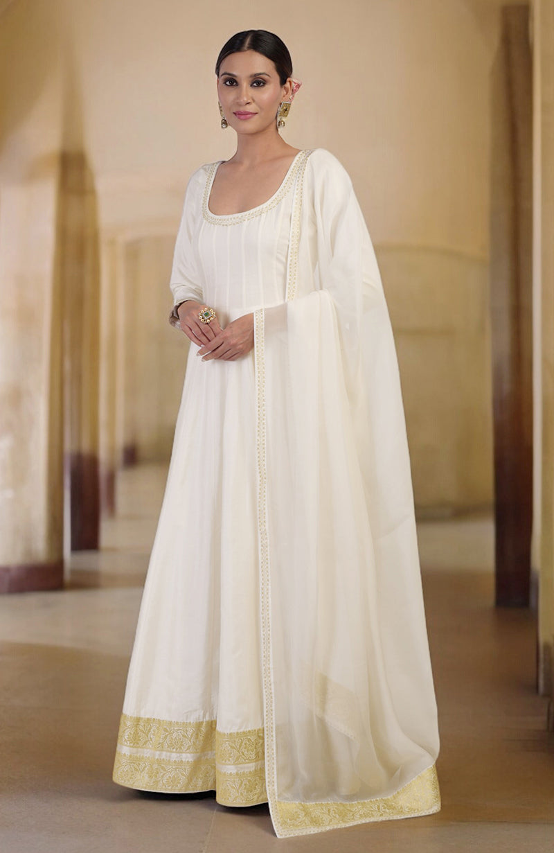 Ivory gold Banarasi handwoven Anarkali set with a scoop neckline and gold border.