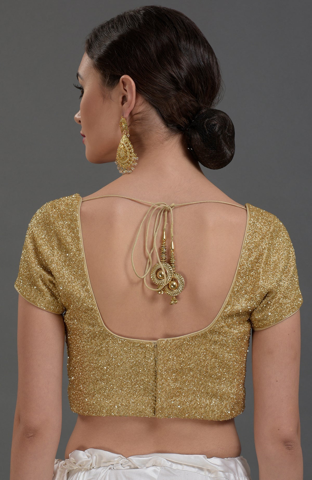 Gold georgette tissue zardozi hand embroidered blouse with back tie-up.
