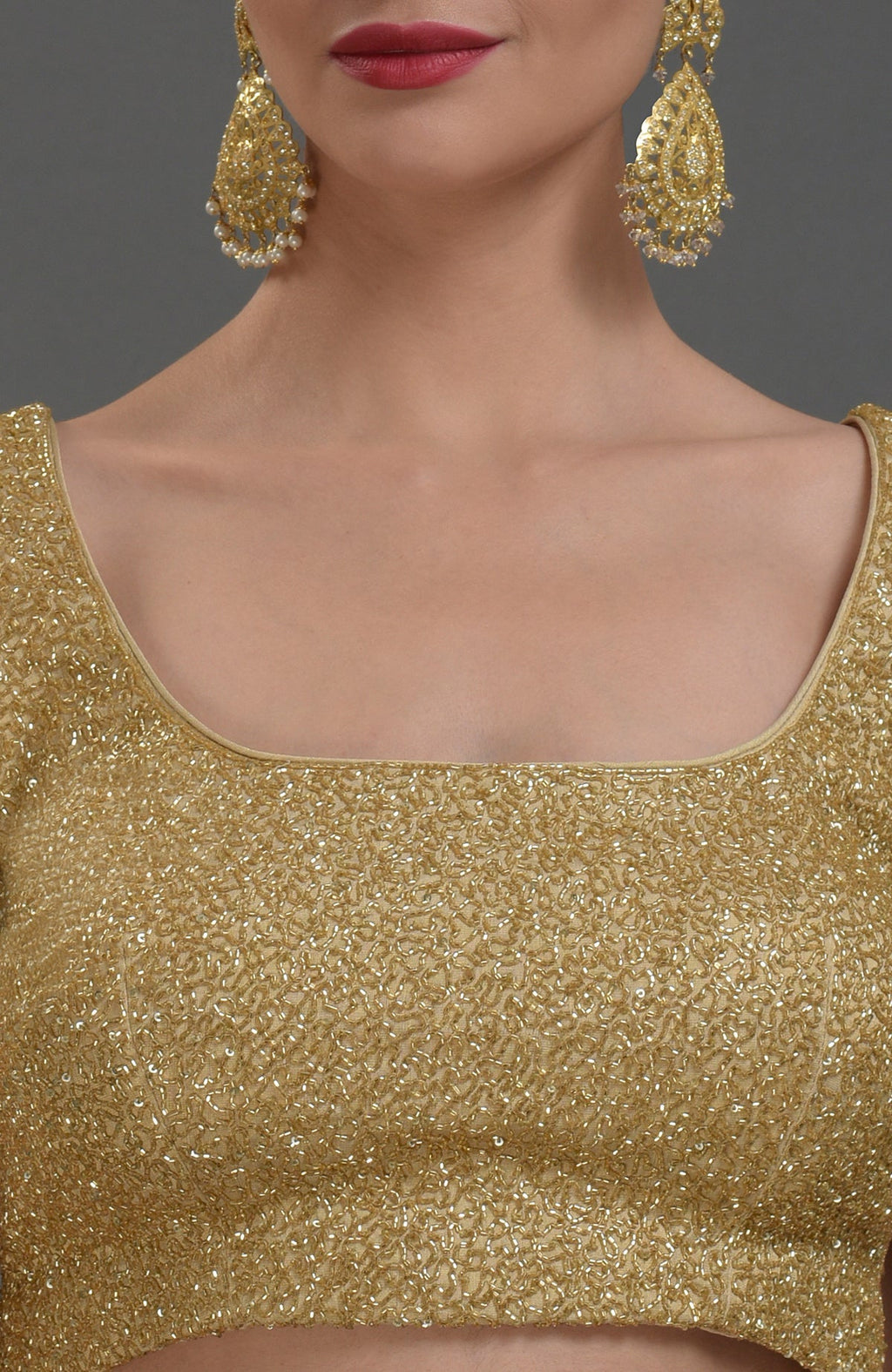Gold georgette tissue zardozi hand embroidered blouse with a square neckline.