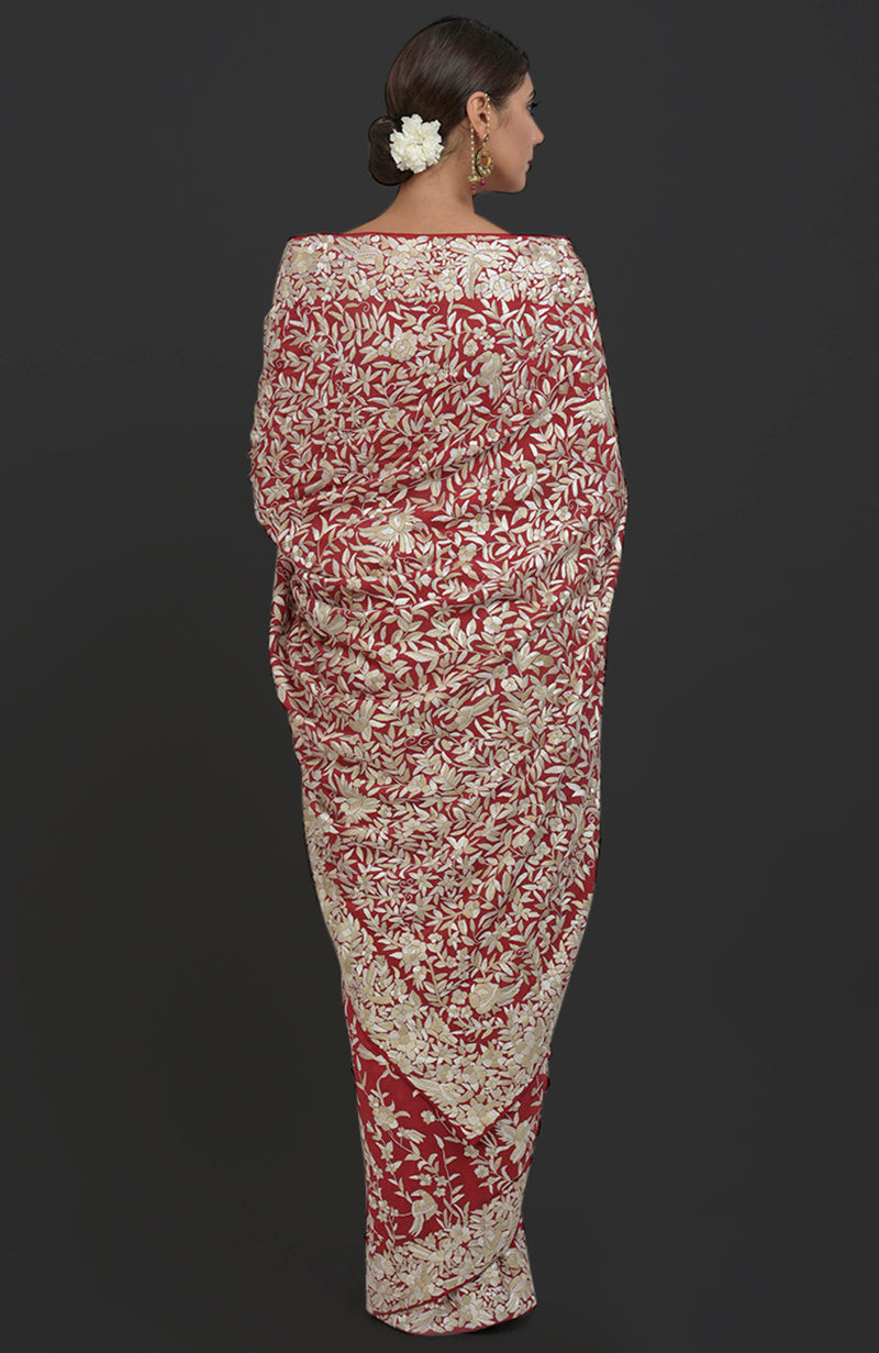 Red Parsi Gara hand-embroidered saree with floral and bird patterns.