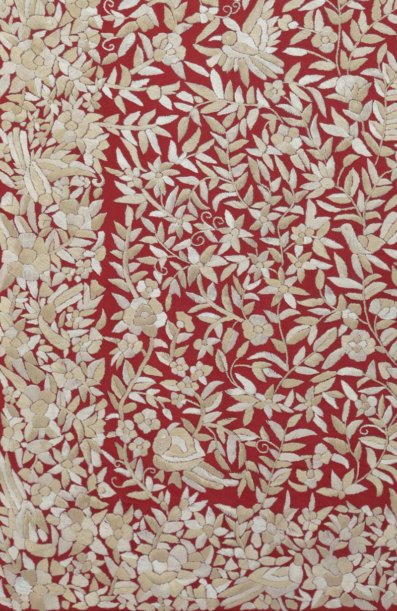 Red Parsi Gara hand-embroidered saree with floral and bird patterns.