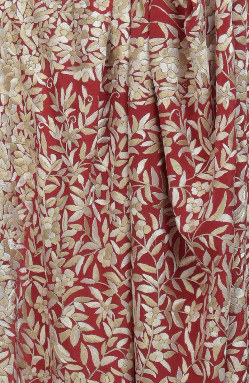 Red Parsi Gara hand-embroidered saree with gold floral and leaf patterns.