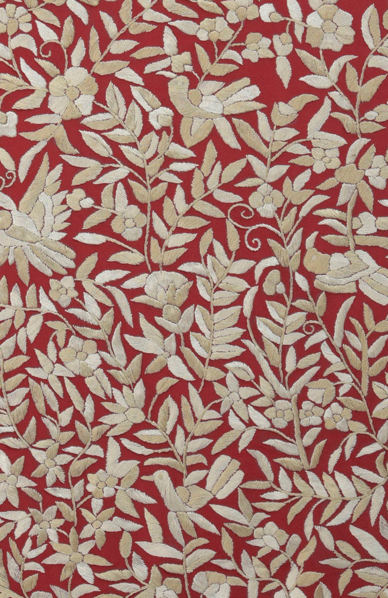 Red Parsi Gara hand-embroidered saree with floral and bird patterns.