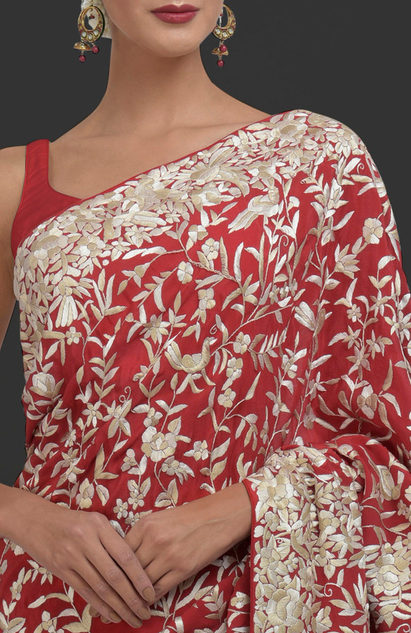 Red Parsi Gara hand-embroidered saree with floral and bird motifs.