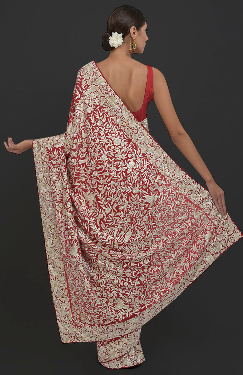 Red Parsi Gara hand-embroidered saree with floral and bird motifs.