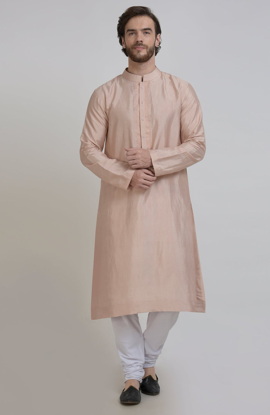 Oyster pink silk kurta with embroidered placket detail, paired with white churidar pants.