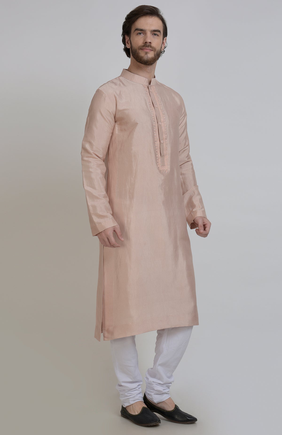 Oyster pink silk kurta with embroidered placket detail, paired with white churidar.