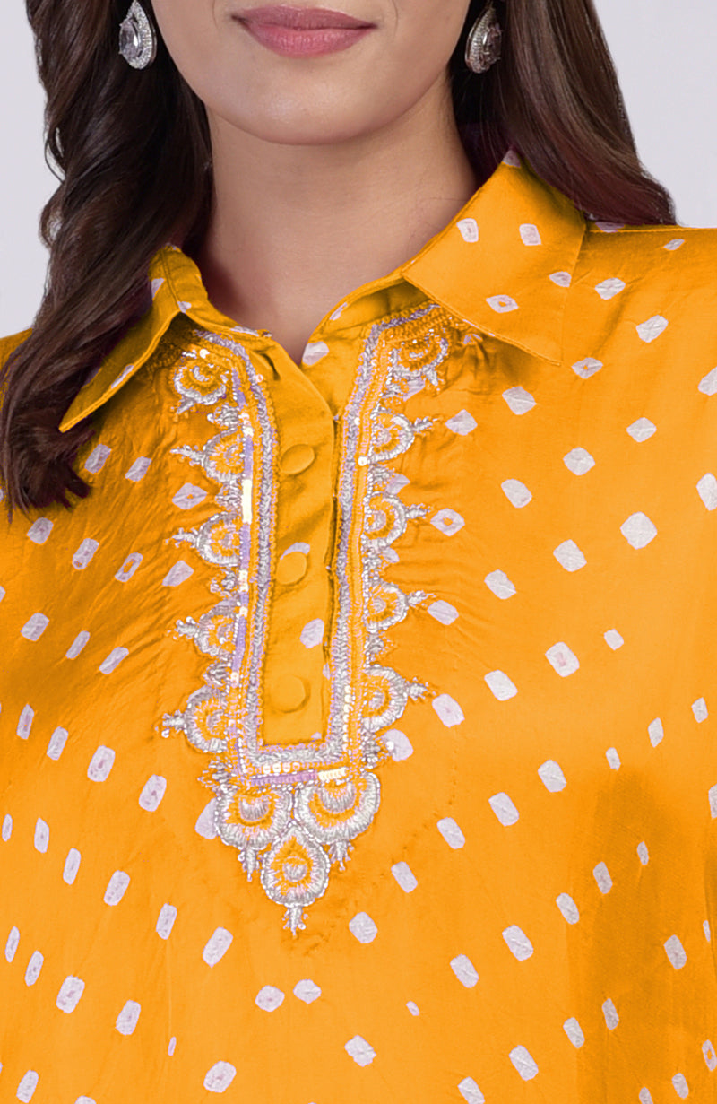 Turmeric yellow bandhej co-ord set with intricate embroidery along the placket.