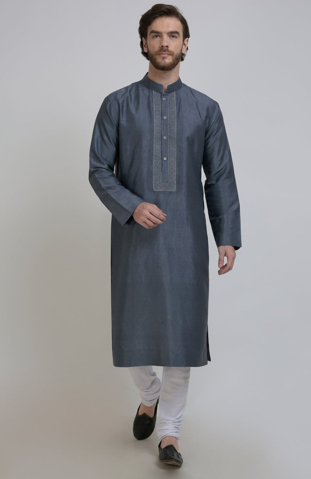 Grey silk kurta with embroidered placket detail, paired with white churidar and black shoes.