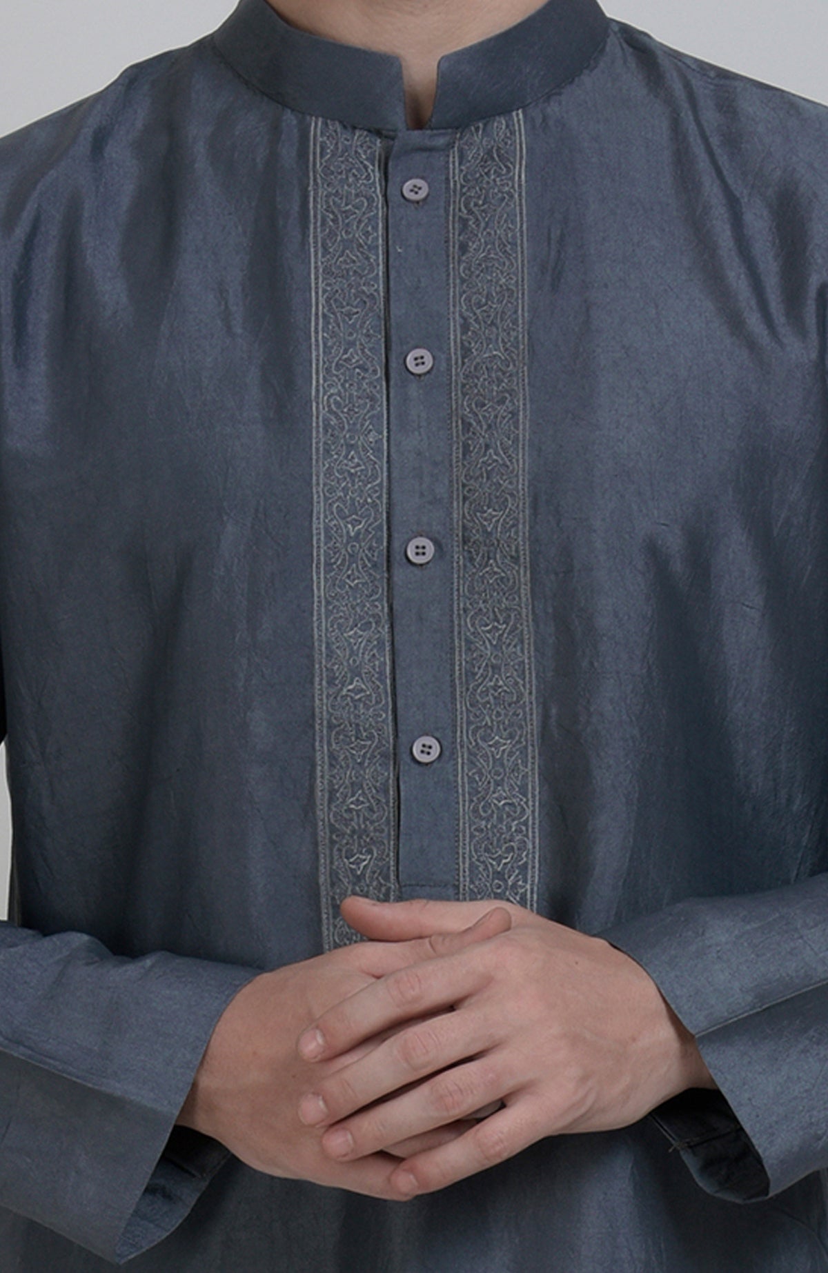 Grey silk kurta with an embroidered placket and button details.