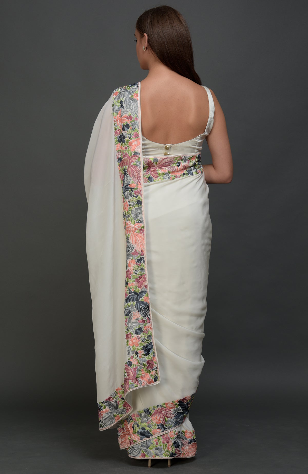 Ivory Parsi Gara hand embroidered saree with floral borders, viewed from the back.